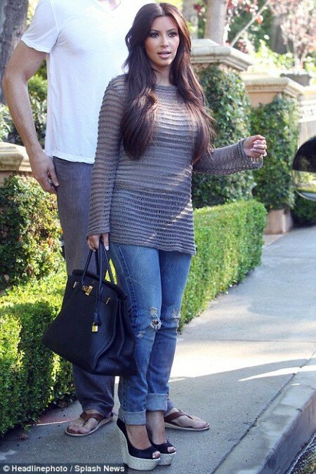 Kim Kardashian shows off huge high heels
